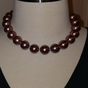 Mauve colored pearl like necklace with bracelet